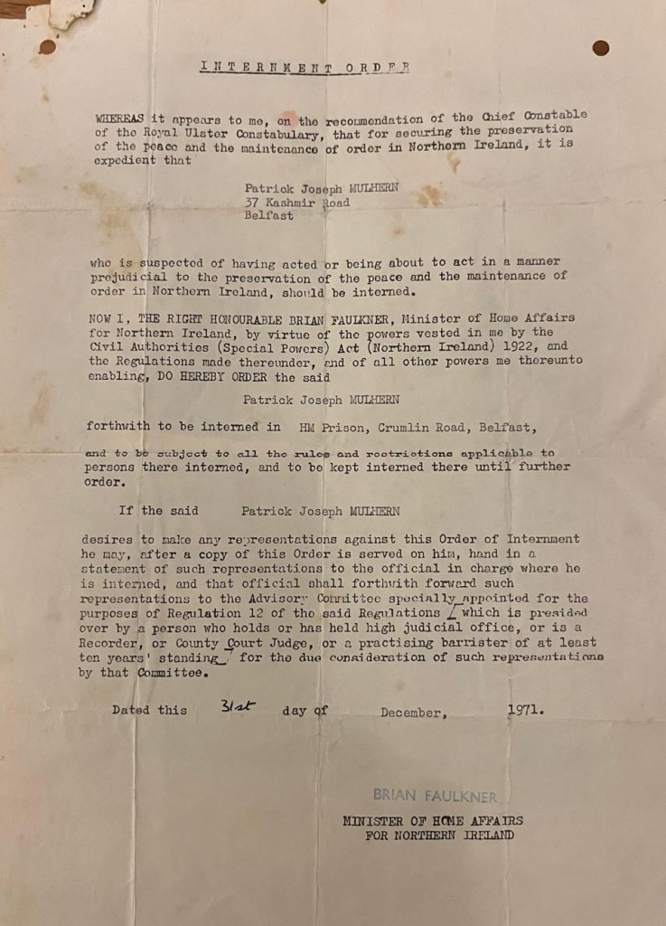 A historical internment order document addressing Patrick Joseph Mulhern, detailing his internment under the authority of the Minister of Home Affairs for Northern Ireland, Brian Faulkner.