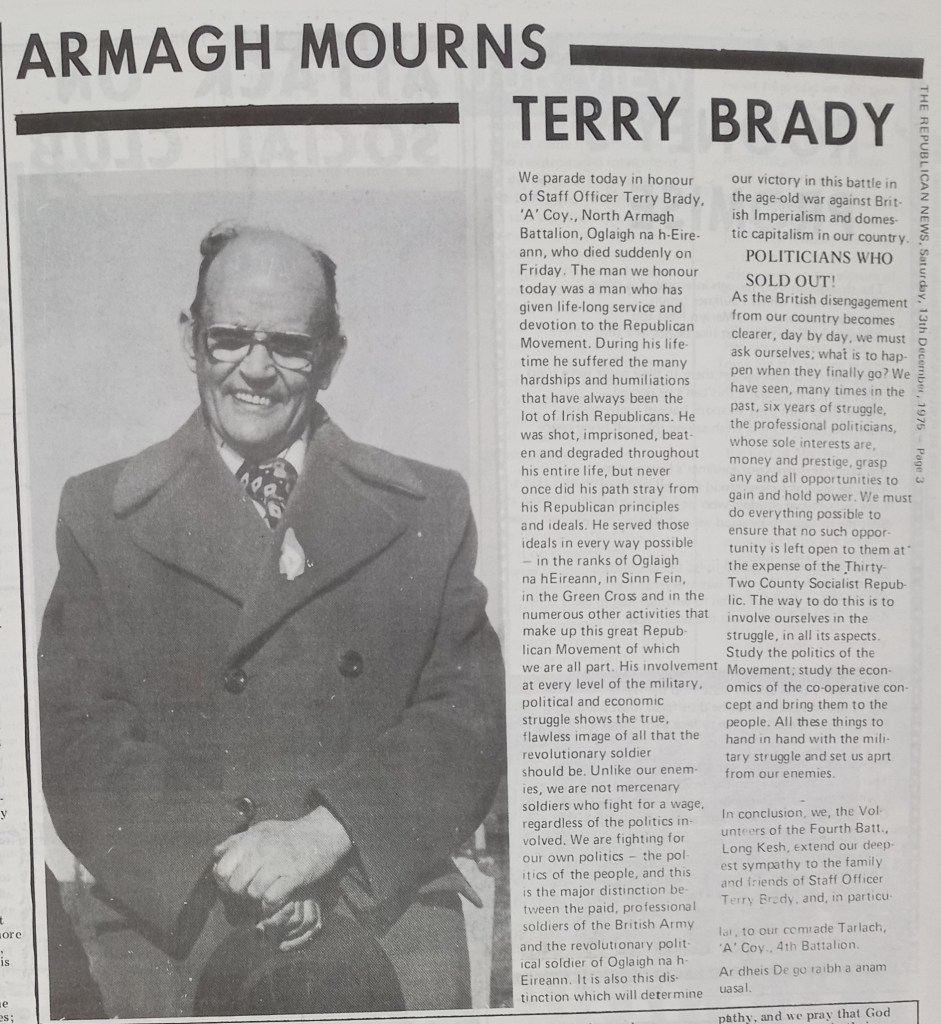 Black and white image of a smiling man wearing glasses and a dark coat with a patterned tie, surrounded by text mourning the loss of Staff Officer Terry Brady.